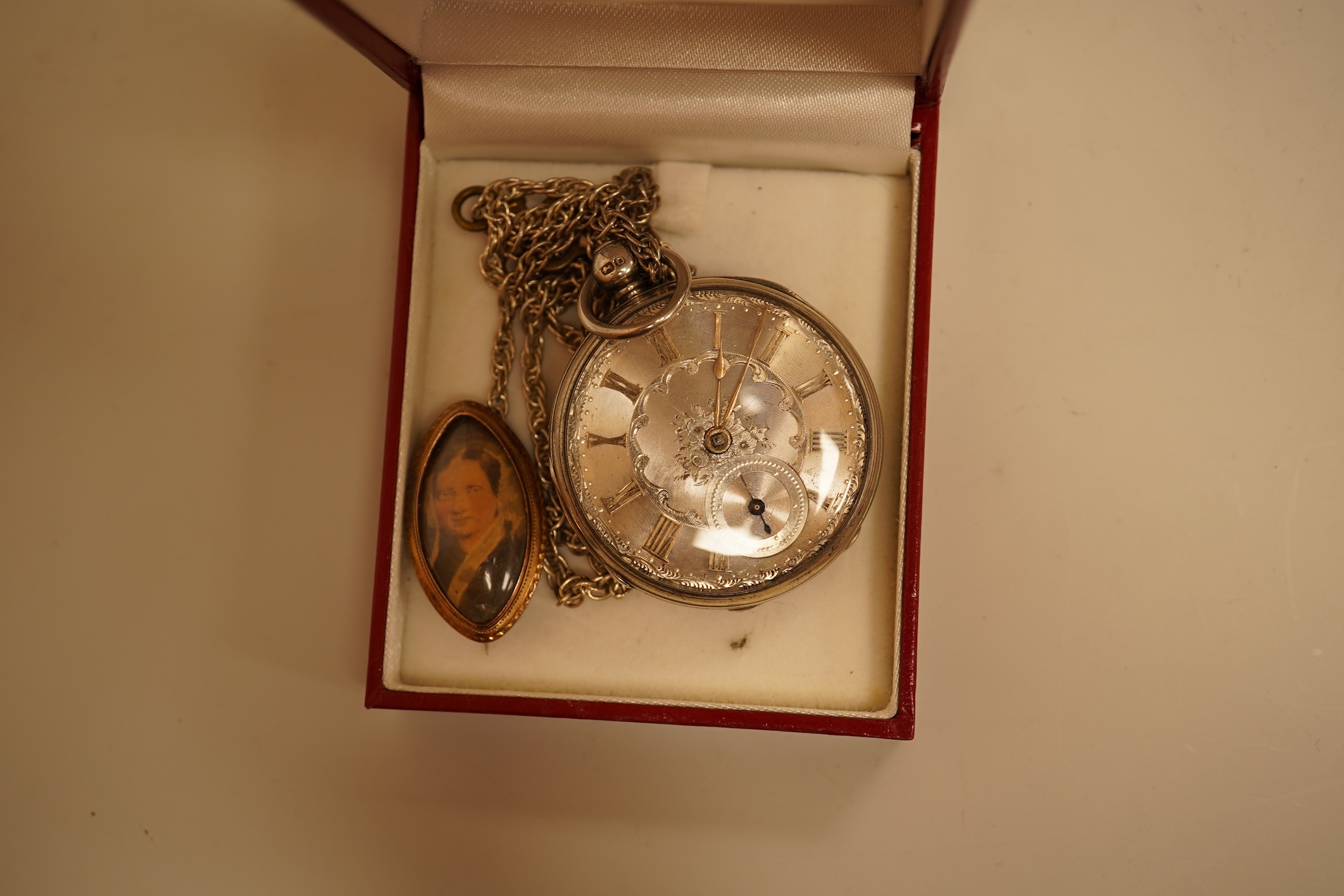 A collection of coins, notes and wrist watches